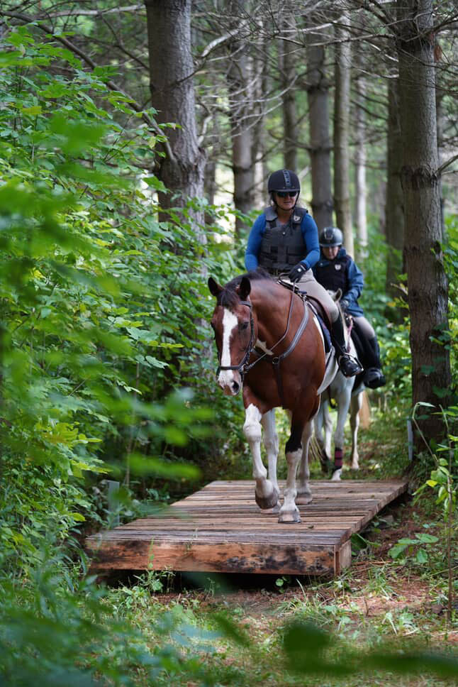 riding on trail in the woods